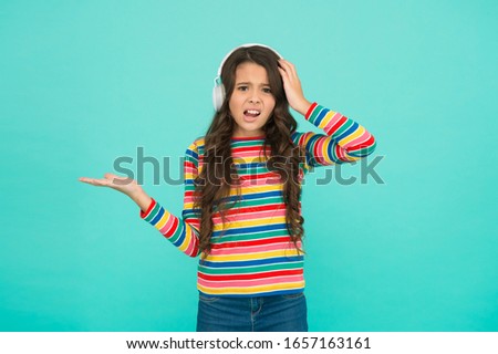Audio translator. Technologies for studying. Girl listening song. Listening school book. Digital technologies for learning. Schoolgirl emotional child in headphones. Audio course. Modern technologies.