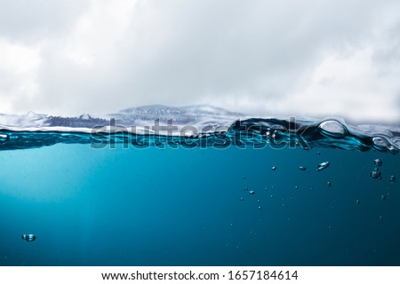 The sea at the time of the storm caused beautiful waves. The water in the turbid sea causes sediment. Royalty-Free Stock Photo #1657184614
