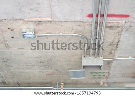 Photos of electrical systems in building construction.Installation of conduits in buildings.Conduit system in building under construction.