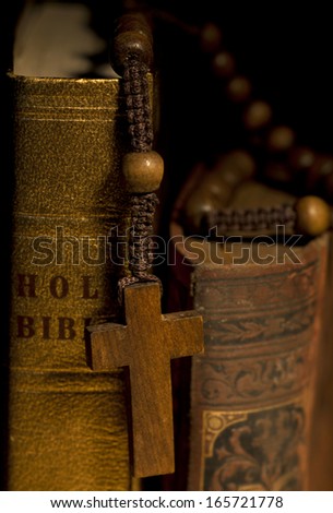 Old Holy Bibles and Wooden Rosary Beads.