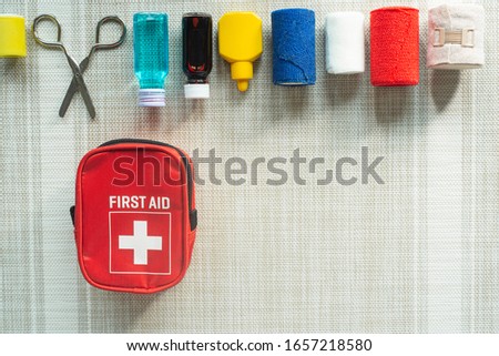 Top view  First aid kit bag with medical equipment and medications for an emergency