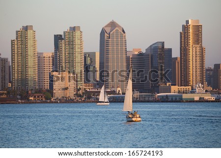 Scenic San Diego skyline, sailboat and waterfront, Pacific Ocean at sunset, California 