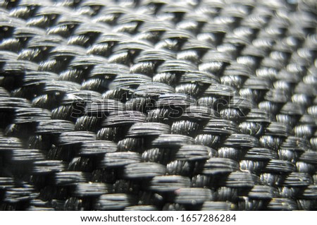 Carbon close-up. Carbon fiber close-up shot. Carbon fiber weaving. Modern carbon materials. Super light materials for building and tuning cars.