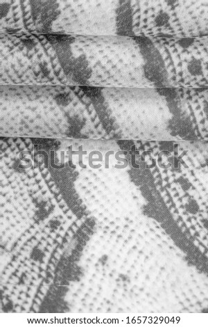 Background, texture, pattern, alkaline white fabric with a pattern of gray squares, lines