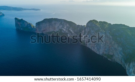 Top view of isolated rocky l island with turquoise water and white beach. Aerial view of Phi-Phi Leh island with Maya Bay and Pileh Lagoon. Krabi province, Thailand.