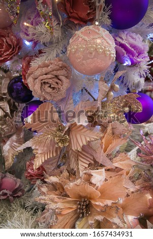 Details of christmas tree with many colored decorations