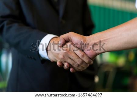 Entrepreneur hand shake and partnership meeting. Investor shaking hands with Small entrepreneurs. Successful, business etiquette, congratulation, merger and acquisition, good deal. drop shipping