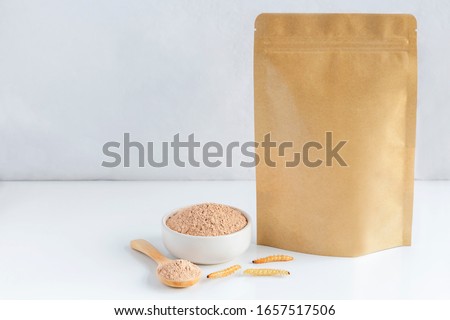 Bamboo worm powder. Bamboo Caterpillar flour for Insects eating as food edible items made of cooked insect meat in bowl and spoon with package bag, it is good source of protein. Entomophagy concept. Royalty-Free Stock Photo #1657517506