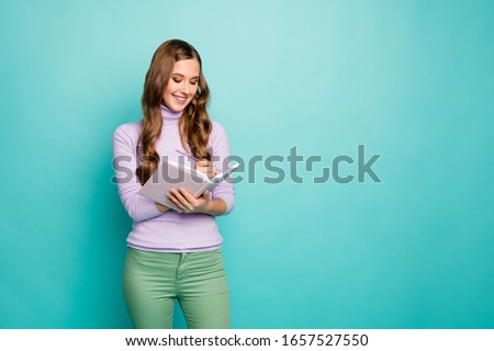 Dear diary. Photo of beautiful wavy lady hold planner write private secrets in journal inspiration moment wear lilac sweater pastel green trousers isolated teal color background
