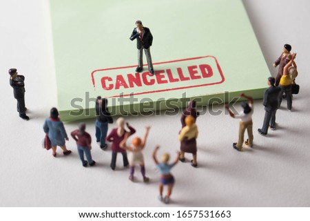 Man with cancelled stamp in front of angry mob. A person is the latest victim of toxic cancel culture. Man is bullied or excluded by friends, family, or social media followers. Offensive guy labelled.
