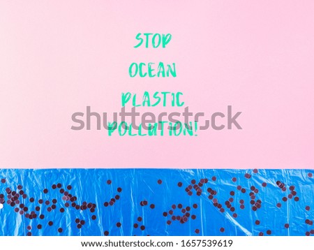 Blue plastic trash bag as sea water surface with confetti as air bubbles on pink background. Ocean plastic pollution text concept