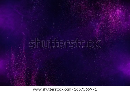 Explosion of shiny colorful dust and smoke abstract background