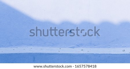 Light and shadow hits the wall of the building. Abstract background.
