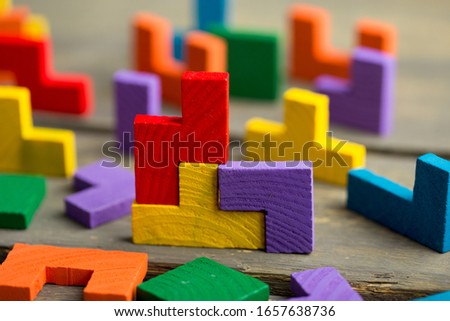 Creative solution for idea - business concept, jigsaw puzzle on the wooden background Royalty-Free Stock Photo #1657638736