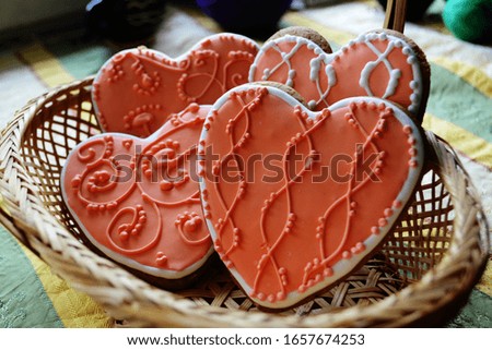 Cute heart cookies on table in basket.
