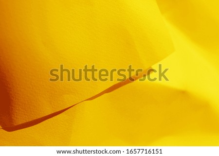 Yellow paper folded and creased