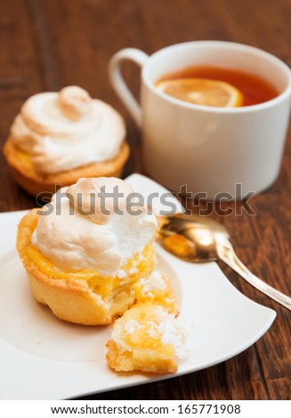 Tartlet with meringue and lemon curd close-up 