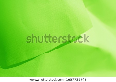 Green paper folded and creased
