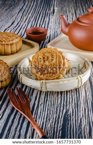 Chinese traditional Mid-Autumn Festival moon cake.((The text is: hawthorn, jujube puree, old five kernels, egg yolk, lotus seed, salt and pepper, mid-autumn moon cake,sesame)