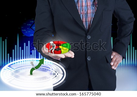 Businessman holding a pie chart
