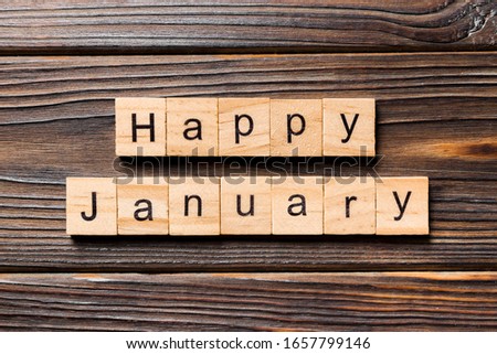 Happy january word written on wood block. Happy january text on table, concept.