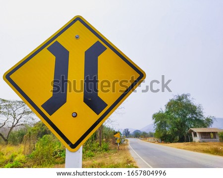 Traffic signs telling to be careful There will be a bridge ahead