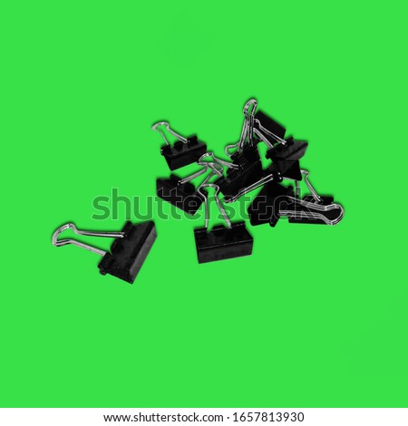 paper clip on green background