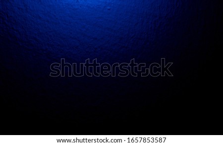 Beautiful abstract blue background on dark of elegant dark blue vintage grunge wall background texture and blue neon light