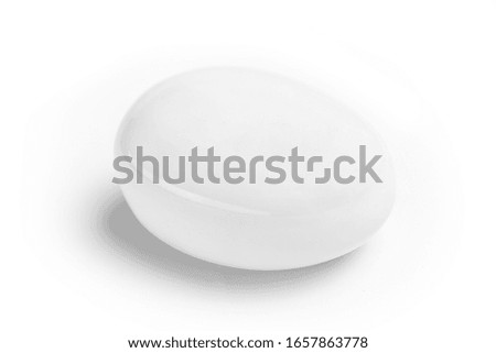 white oval stones on a white background