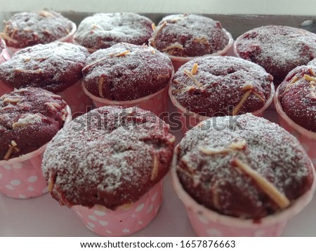 Image of a lot of cheese chocolate cupcakes in supermarket bakery