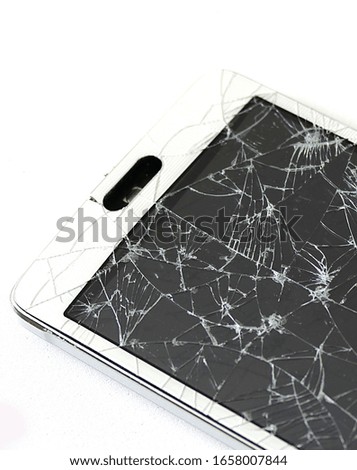 broken phone with screen glass broken on white ground,