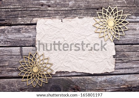 old paper with golden snowflakes