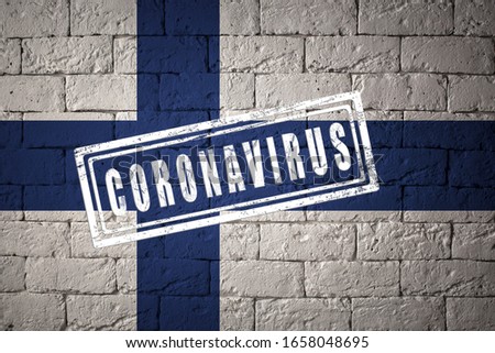 Flag of the Finland with original proportions. stamped of Coronavirus. brick wall texture. Corona virus concept. On the verge of a COVID-19 or 2019-nCoV Pandemic.