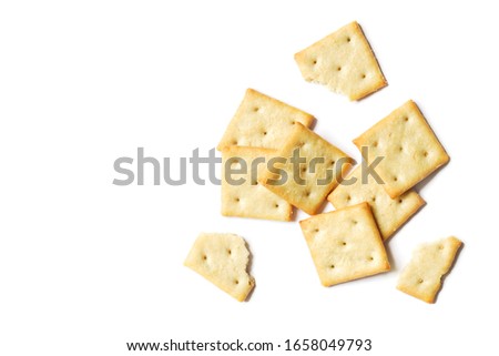 Crispy salty cracker on a white background. Flat lay food photography