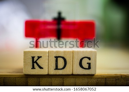 Letters with in german KDG Katholisches Datenschutzgesetz in english Catholic data protection law with lights in the background