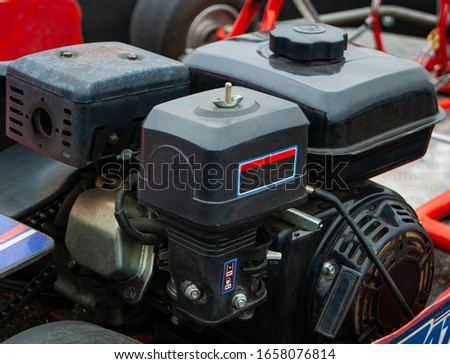 motor mounted on kart, side view.

