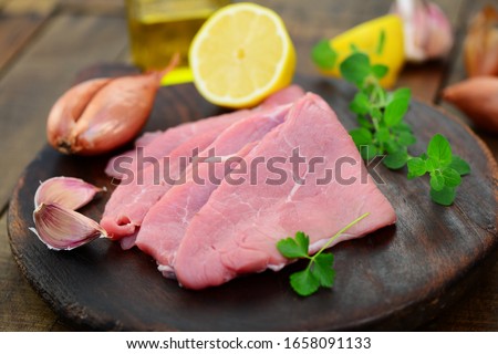 
Veal escalope with shallots and parsley Royalty-Free Stock Photo #1658091133