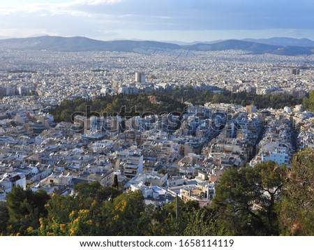 Zoom photo of urban dense populated city of Athens as seen from Lycabettus hill at spring, Attica, Greece