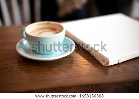 Girl draws a picture in a cafe
