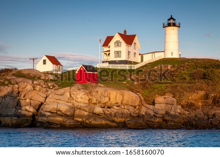 Nubble Lighthouse at sunset, Cape Neddick, York, Maine, USA