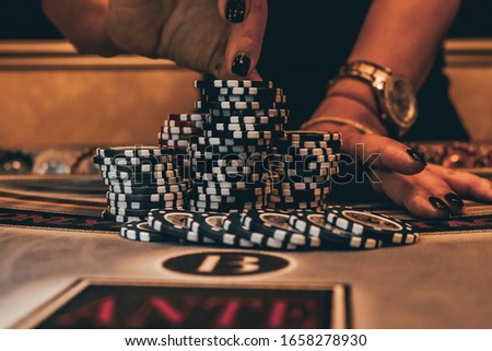 Poker chips on table in casino.
