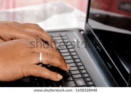 Closeup view of typing on computer keyboard - people at work