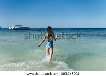 young woman in a swimsuit with a beautiful figure model
