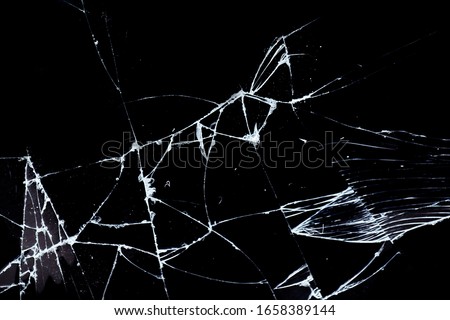 Broken scratched smashed cracked glass background 