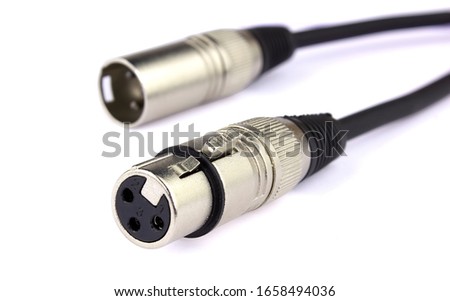 XLR connector for microphone cables isolated above white background