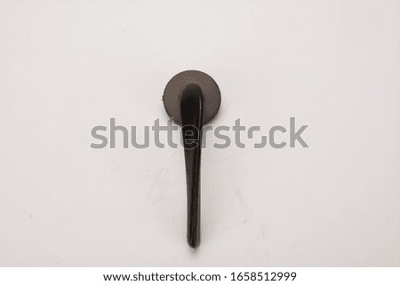 Black long handle door handle on white background