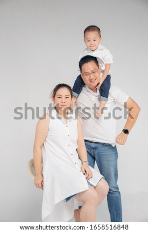 Chinese Thai family ,little kid hold his parent together for taking picture