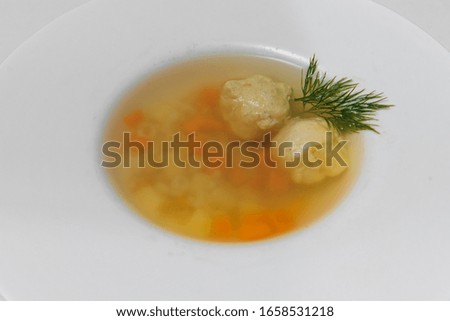 Bean soup with meatballs, vegetables and dill