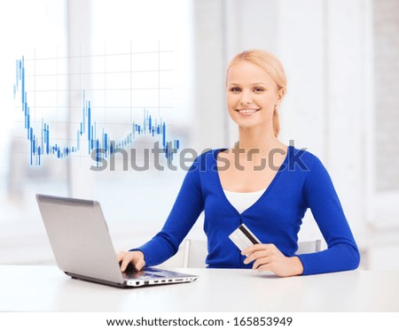 money, business and new technology concept - smiling young woman with laptop computer, credit card and forex chart
