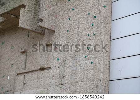 view of a concrete climbing wall